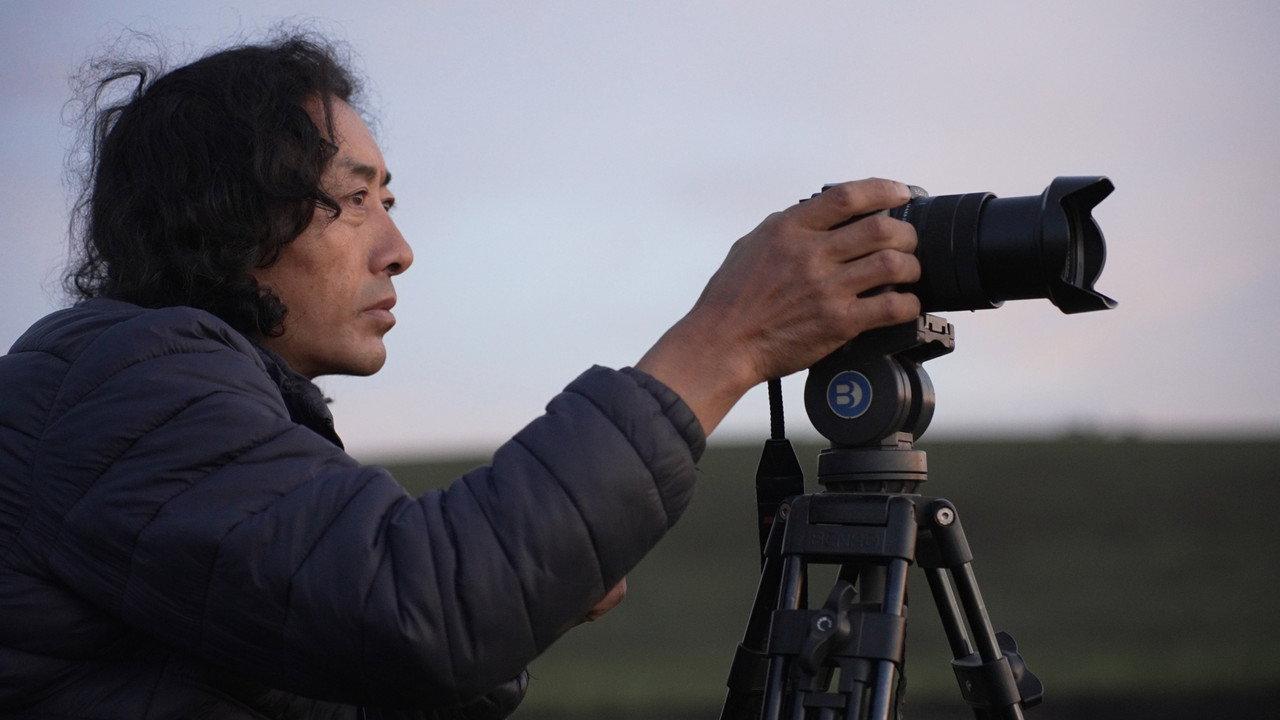 My Lens, My Land backdrop