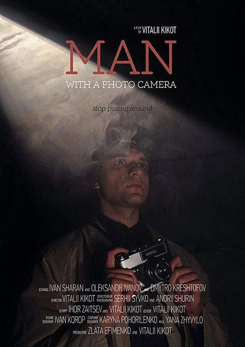 Man with a photo camera backdrop